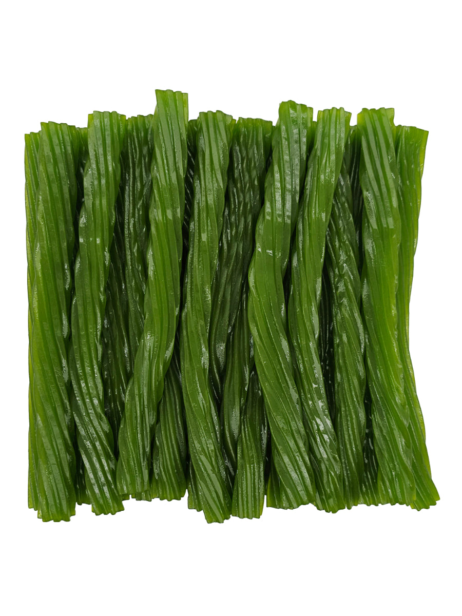 Green apple licorice twists neatly arranged together.